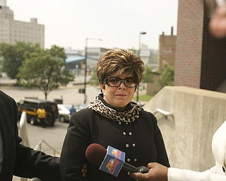 ROBERT K. YOSAY | THE VINDICATOR...ROBERT K. YOSAY | THE VINDICATOR ..Flora Cafaro with her attorney William Doyle walks up the stairs to the Mahoning County Justice Center to be booked after being indicted by a grand Jury - he was joined by Michael Sciortino, John McNally IV and ,Marty Yavorcik .-30-...-30-