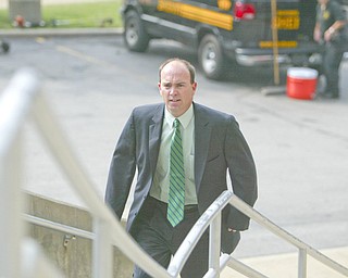 ROBERT K. YOSAY | THE VINDICATOR...ROBERT K. YOSAY | THE VINDICATOR ..John McNally IV walks up the stairs to the Mahoning County Justice Center to be booked after being indicted by a grand Jury - he was joined by Flora Cafaro Michael Sciortino,.Martin Yavorcik,and ,Flora Cafaro, ..-30-...-30-