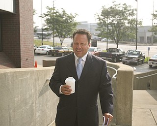 ROBERT K. YOSAY | THE VINDICATOR...ROBERT K. YOSAY | THE VINDICATOR ..Michael Sciortino walks up the stairs to the Mahoning County Justice Center to be booked after being indicted by a grand Jury - he was joined by Flora Cafaro Martin Yavorcik,.John McNally IV and ,Flora Cafaro, ..-30-...-30-