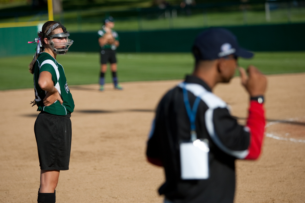 Arilia Duarte eyeballs the coach from Puerto Rico trying to decipher his signals to the batter during the 2010 World Series of Little League Softball, Central vs. Latin America. Central went on to win the game, 7-4.