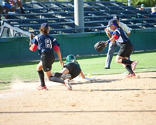 Jenna Schettler dives back to third safely after attempting to steal home during the 2010 World Series of Little League Softball, Central vs. Latin America. Central went on to win the game, 7-4.