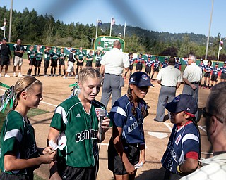 Players from each team recite the LIttle League pledge during the 2010 World Series of Little League Softball, Central vs. Latin America. Central went on to win the game, 7-4.