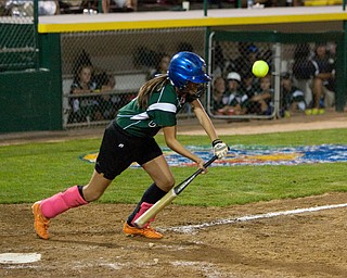 Dani Rutana connects with a solid bunt during the World Series of Little League Softball in Portland, Ore., July 13th, 2010. The team from Poland, OH went on to beat the team from Brenham, TX, 5-4.