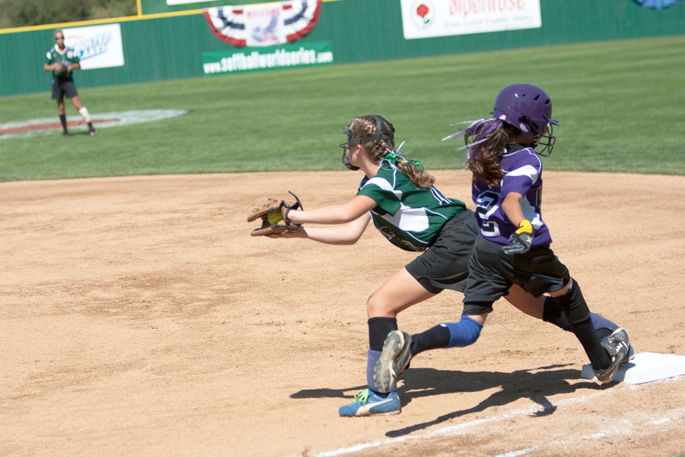Ally Deemer brings the ball into her glove to get the runner out at 1st during the 2010 World Series of Little League Softball in Portland, Ore., August 15th, 2010. This game the team from Poland, Ohio face the team from Burbank Calif., Central was defeated by West, 0-1.