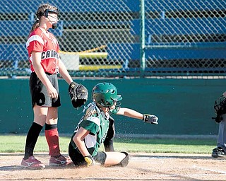 Claire Testa slides safely into home during the 2010 World Series of Little League Softball in Portland, Ore., August 16th, 2010. The team from Poland, Ohio beat the team from Canada, 7-1, and will advance to Semi-Final play.