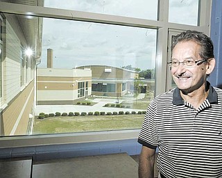 Richard Buchenic, superintendent of Hubbard School District, stands near a second-floor window in the new Hubbard High School, which looks out over the new construction. School starts Sept. 1 at the $20 million state-of-the-art high school, which includes three computer labs and 245 new computers.