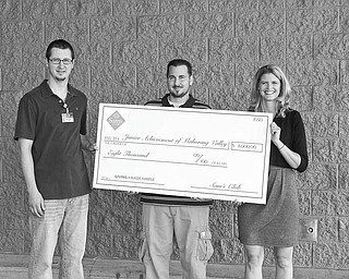 Giving Made Simple: During a Giving Made Simple campaign, which ran from April 8 to May 2, Sam’s Club members and associates voted to determine how $4 million in charitable giving should be distributed among eight nonprofit organizations. Junior Achievement USA drove the most online votes during the campaign to win $500,000, of which Mahoning Valley Junior Achievement received an $8,000 grant. The grant will allow the youth development nonprofit organization to expand its educational programs. At the conclusion of the campaign, from left, Doug Duncan and Steve Lucente, from Sam’s Club in Boardman, present a huge facsimile of the check to Michele Merkel, JA president.