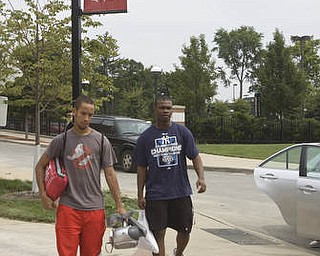 LISA-ANN ISHIHARA | THE VINDICATOR..Roommates and YSU freshmen Kirell Gunther, 20, of Columbus and Dondre Brandford, 17, of Queens, NY carry their stuff on move in day.