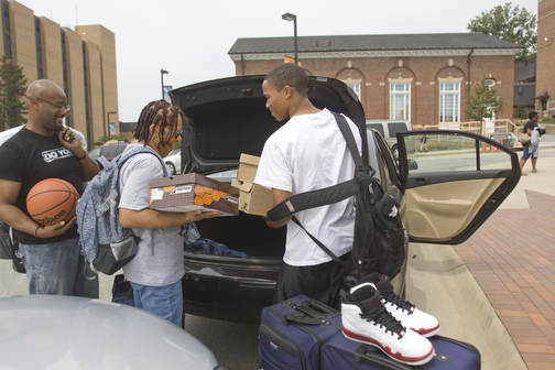 LISA-ANN ISHIHARA | THE VINDICATOR..YSU freshman Cordell Miller, 17, far right, of Mt. Vernon, NY gets help unloading from his mother Felicia Miller, of Mt. Vernon, NY, and his older brother DJ Baker of Brooklyn, NY.