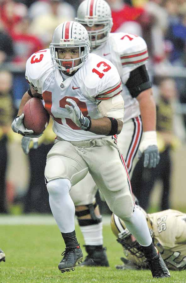 In this Nov. 8, 2002 file photo, Ohio State running back Maurice Clarett runs against Purdue in West Lafayette, Ind. Clarett is asking a judge to allow him to travel to try out with  the Omaha Nighthawks football team of the United Football League Clarett pleaded guilty in 2006 to aggravated robbery and carrying a concealed weapon and served 3½ years in a Toledo prison. He is attending classes at Ohio State while living in a detention facility in Columbus.