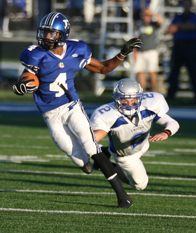 ROBERT K. YOSAY | THE VINDICATOR..HUBBARD @ POLAND -   Polands #4 Darius Patton clears a Hubbard tackler #2 Cory Rushwin as Darius returns a first quarter punt ..-30