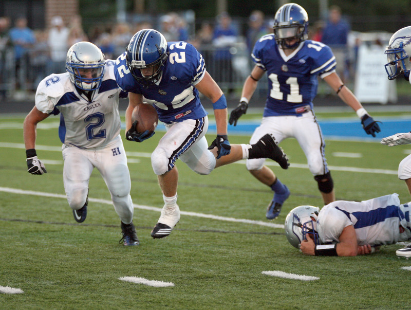ROBERT K. YOSAY | THE VINDICATOR..HUBBARD @ POLAND -   Polands #22  - not on the roster -  ( i think its John Medina) Takes off in the air after breaking the tackle of Hubbards #1 Daniel Duvall as Hubbards #2 Cory Rushwin  gives chase .. looking on is Polands #11  Mike Costello -.-30