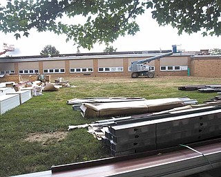 Construction material lies stacked outside Joshua Dixon Elementary School in Columbiana. Renovations and expansion there are part of a $5.5 million project in the school district.