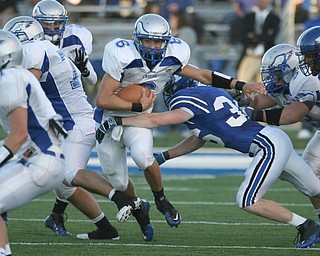 ROBERT K. YOSAY | THE VINDICATOR..HUBBARD @ POLAND -  Hubbards #6    Michael Lupuchovsky   tries to break the tackle of Poland #36  Hochendoner  as  he get talckled behind the line.-30