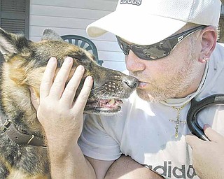 Sam Vona of Struthers and Gannon, his seeing-eye dog, are reunited. The dog disappeared Saturday evening, and Vona got him back Tuesday morning..