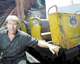 Robert Karzmer of Youngstown has brought a car from an Idora Park roller coaster to the Canfield Fair. Fairgoers who miss the Wildcat, or were born after the park’s closure in 1984, can hop in the coaster car and have their picture taken in it with an 8-foot-by-10-foot backdrop of the Wildcat track for $10.