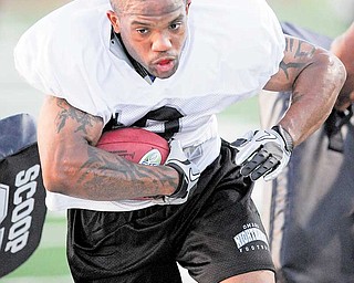 Maurice Clarett runs drills during practice with the Omaha Nighthawks on Monday Aug. 30, 2010 in Omaha, Neb. Former Ohio State star =Clarett has signed a one-year contract with the United Football League team.