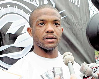 Maurice Clarett speaks to reporters following team practice with the United Football League's Omaha Nighthawks in Omaha, Neb., Wednesday, Sept. 1, 2010. Clarett, who recently finished a prison sentence for robbery, is trying to revive his football career after being out of the game since 2005.(AP Photo/Nati Harnik)