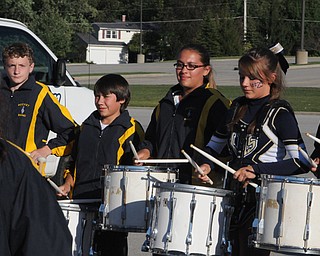 Pictured are just a few of the Lowellville Drumline members who entertained the crowds before the lowellville/ YCS game on Friday. - KELLY TKACH