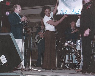 Chuck Cavanaugh of New Middletown submitted this Canfield Fair memory. Johnny Cash's band leader, Bill Dotson, is presenting Cash with a portrait he drew of him in 1968. Cavanaugh got Cash to autograph the drawing.