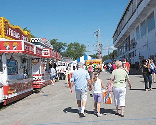 Hailey Kadivar of Bradenton, Fla., walks with her grandparents, Bob and Joan Stroh of Poland.
