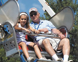 Hailey Kadivar of Bradenton, Fla., granddaughter of Bob and Joan Stroh of Poland, rides the Ferris wheel with her grandfather.