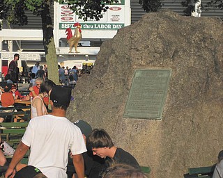 People gather near The Rooster and The Rock to meet at the 2009 Canfield Fair. Photo submitted by John Simpkins.