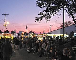 Crowds enjoy the Canfield Fair and the sunset during an evening in 2009. Photo submitted by John Simpkins.
