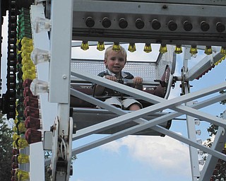 Bryson Nichols of Austintown has fun on the kiddie Ferris wheel at the 2009 fair. Photo sent in by John Simpkins.