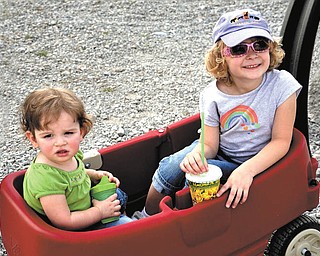 Brienna, left, and Natalie Kollar of Hudson, Ohio, enjoy a wagon ride. The photo was submitted by their grandmother, Elaine Kollar of Lowellville.
