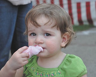 Brienna Kollar, 1 1/2, of Hudson, Ohio, gets her first taste of cotton candy. Elaine Kollar of Lowellville, her grandmother, took the photo in 2009 at the fair.
