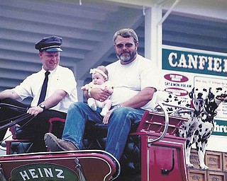 At the 1997 fair, Gary Hemphill Sr. of North Jackson got to ride on the wagon in the Heinz Hitch attraction. Above, his granddaughter Abby, who was born in May of that year, rides along. Hemphill said Abby is now 13 and hasn't missed one day of the Canfield Fair.