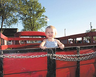 Payton Zwingler of Columbiana, daughter of Chad and Alyson Zwingler, was only a year old when she visited the farm equipment display at the fair. Her parents say they come from a Òhuge family of fair loversÓ and even camp out at the fair.