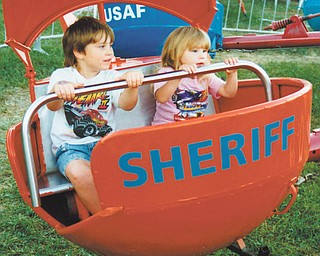 Leanna and Aaron Hartsough of Canfield are on one of the many rides in Kiddie Land.