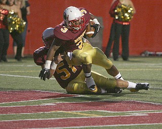 ROBERT K. YOSAY | THE VINDICATOR..Mooneys #3 Roosevelt Griffith almost falls but is helped into the endzone by #51 Carmen Lanzo as Mooney Scored its second touchdown - Boardman @ Mooney (YSU).-30