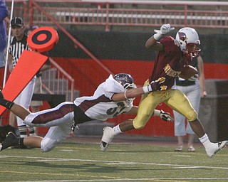 ROBERT K. YOSAY | THE VINDICATOR..GOOD SAVE as Boardmans # 33 Carmen Tarantino barely catches #3 Roosevelt Griffith as he gets pushed out at the 3 yard line - Boardman @ Mooney (YSU).-30