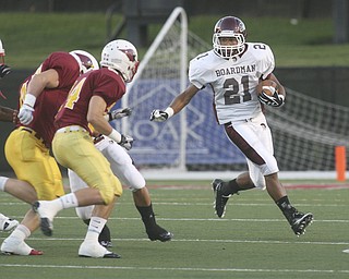 ROBERT K. YOSAY | THE VINDICATOR..Boardman @ Mooney (YSU) Boardman #21 Rocky Falleti makes a move on Mooney #47 Pat McGlone and #44 Chris Brandenstein.-30