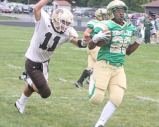 URSULINE - (26) Akise Teague just beats (11) Mike Yildiran into the end zone Saturday afternoon. - Special to The Vindicator/Nick Mays