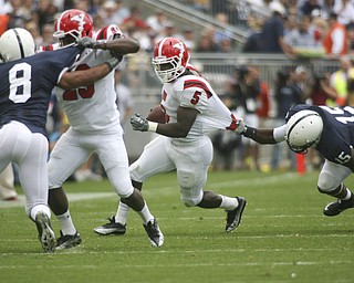 ROBERT K. YOSAY | THE VINDICATOR..Second quarter action as YSU #5 Randy Louis gets caught by PSU #15 Bany Gbadyu making the block is #29 YSU Dominique Barnes on #8 PSU D'Anton Lynn- he made the first down..YSU LOSES 44-14 PENN STATE at BEAVER STADIUM IN HAPPY VALLEY.-30
