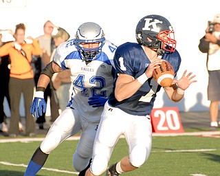 Hubbard linebacker #42 Blake Novotny puts the pressure on Warren JFK quarterback #1 Zach Nicholas.