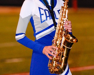 Hubbard junior cheerleader and saxophone player Maggie Logan plays during half time.