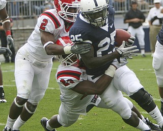 ROBERT K. YOSAY | THE VINDICATOR..YSU #23 Nick Gooden Tackles #25 PSU Silas Redd with the help of YSU #2 Andre Elliott during third quarter action..YSU LOSES 44-14 PENN STATE at BEAVER STADIUM IN HAPPY VALLEY.-30