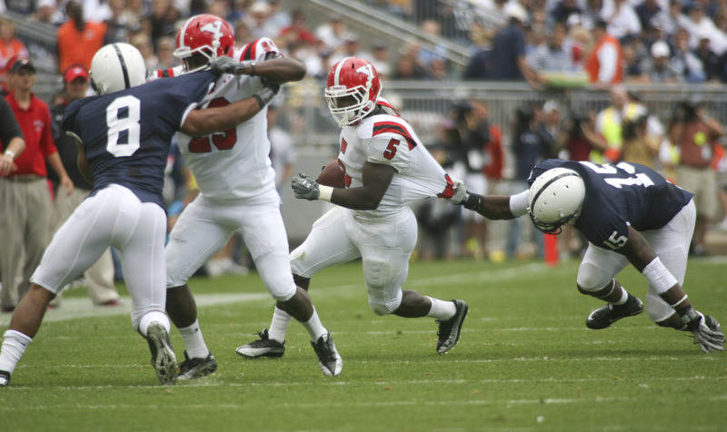 ROBERT K. YOSAY | THE VINDICATOR..Second quarter action as  YSU #5 Randy Louis gets caught by PSU  #15 Bany Gbadyu making the block is #29 YSU  Dominique Barnes on #8 PSU D'Anton Lynn- he made the first down..YSU  LOSES 44-14   PENN STATE at BEAVER STADIUM IN HAPPY VALLEY.-30