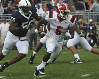 ROBERT K. YOSAY | THE VINDICATOR..Big Romp as YSU #5 Adaris Bellamy takes off with PSU #56 Eric Latimore in pursuit during first half action.YSU LOSES 44-14 PENN STATE at BEAVER STADIUM IN HAPPY VALLEY.-30