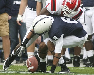 ROBERT K. YOSAY | THE VINDICATOR..YSU #1 Brandian Ross puts a hit on PSU #8 D'Anton Lynn to make him drop a third quarter pass .YSU LOSES 44-14 PENN STATE at BEAVER STADIUM IN HAPPY VALLEY.-30