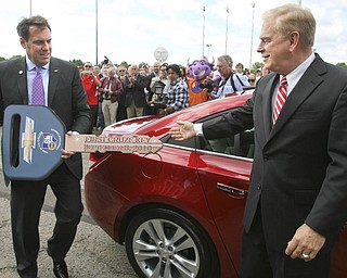ROBERT K. YOSAY | THE VINDICATOR..GM North American Mark Reuss brings around the symbolic key to the first Cruze - ..-30-..
