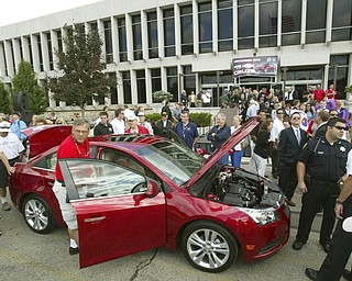 ROBERT K. YOSAY | THE VINDICATOR..people swarm the new Cruze - GM Lordstown Kicked Off the Chevy Cruze today at the Lordstown Plant with the President of GM - Tim Ryan - The Boardman Band and a slew of elected officials -..-30-..