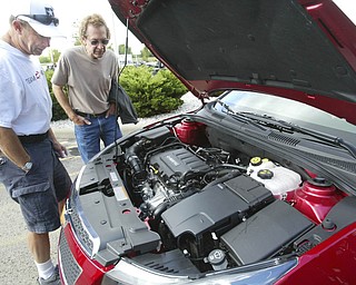 ROBERT K. YOSAY | THE VINDICATOR..Joe Dangler of Pittsburgh and Jim Linden of Niles - look at the Power for the - GM Lordstown Kicked Off the Chevy Cruze today at the Lordstown Plant with the President of GM - Tim Ryan - The Boardman Band and a slew of elected officials -..-30-..