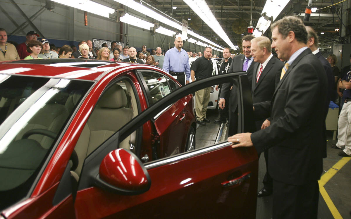 ROBERT K. YOSAY | THE VINDICATOR..GM North America President  Mark Reuss -  Gov. Ted Strickland and Sherrod Brown inspect a Cruze as it comes off the GM Lordstown  Kicked Off the Chevy Cruze today at the Lordstown Plant  with the President of GM - Tim Ryan - The Boardman Band and a slew of elected officials -..-30-..