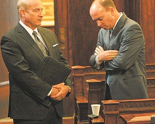 John B. Reardon, former Mahoning County treasurer, left, and county Commissioner John A. McNally IV talk in
Mahoning County Common Pleas Court before the initial pretrial conference in the Oakhill Renaissance Place
criminal conspiracy case, in which both are defendants.